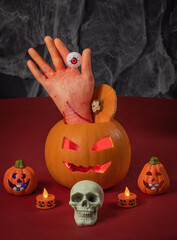 Gennevilliers, France - 10 17 2021: The table for Halloween with pumpkins, skull, cut arm and candles