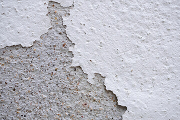 Abstract old white concrete wall with peeling paint