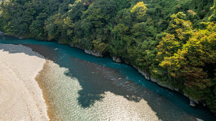 Emerald green river that flows through rocks
