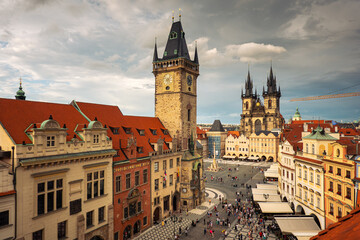 Obraz premium Prague, Czech Republic - 2021: Amazing sunset with top aerial view to the Old Town Square in this beautiful landmark of Europe. Astronomical Clock in the photo. Travel photography.