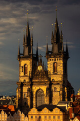 Fototapeta premium Prague, Czech Republic - 2021: Amazing sunset with top aerial view to the Old Town Square in this beautiful landmark of Europe. Astronomical Clock in the photo. Travel photography.