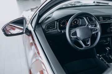 Obraz premium Steering wheel inside a new car close up