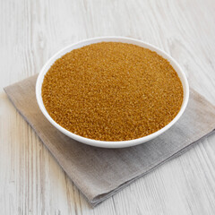 Organic Brown Sugar in a White Bowl, low angle view.