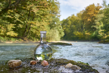 Flask with clear river water.