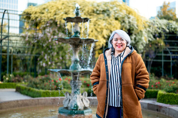 Portrait of a woman with gray hair at the park