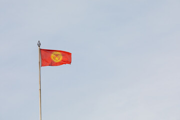 Kyrgyzstan flag waving on a flagpole with islamic star and crescent elements