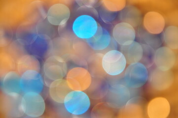 Obraz premium Glitter vintage lights background. gold, silver, blue and white. abstract blurred image.