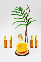 The concept of natural skin care product and cosmetics made from organic ingredients. Orange half...