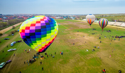 Obraz premium Balloon against the blue sky in flight, colorful fun entertaining form of transport, flight in the air of the balloon, the concept of dream and happiness