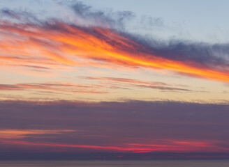 Vibrant sunset sky over ocean 