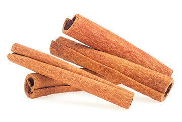 Aromatic dried cinnamon sticks isolated on a white background, front view.