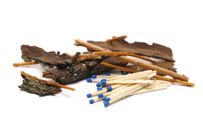 Fire matches, matchsticks with blue tips and dry tree branch, twig isolated on white background