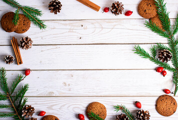 Christmas background - decorations and fir branches on a wooden table