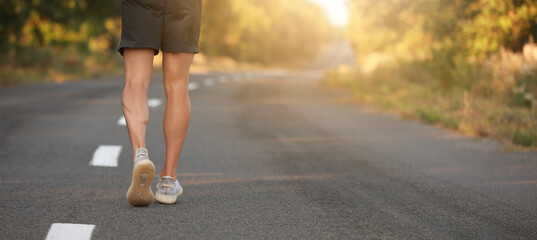 Sporty young man running outdoors
