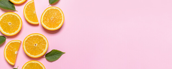 Slices of ripe oranges on color background with space for text