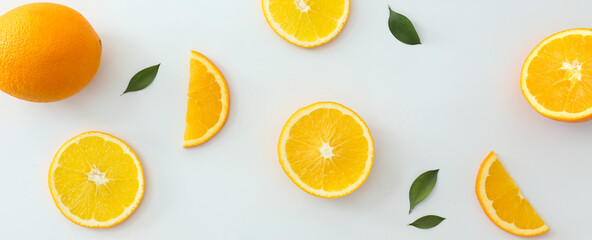 Cut sweet oranges on light background