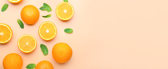 Juicy orange fruit and mint on color background with space for text