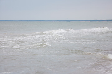 Seascape view of waves in Baltic sea. Photo taken on a warm overcast day.