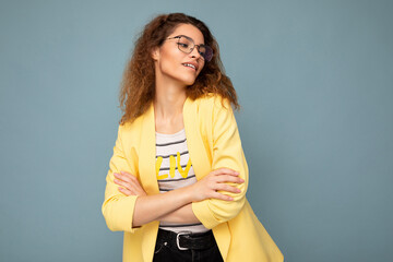 Photo of young positive arrogant beautiful brunette curly woman with sincere emotions wearing...