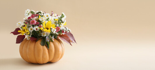 Beautiful autumn bouquet in pumpkin on light background with space for text