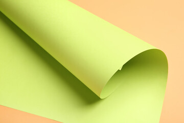 Rolled paper sheet on color background