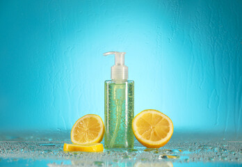 Bottle of cosmetic product and cut lemon on color background