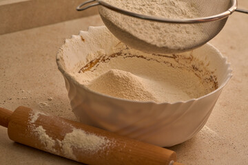 flour sifter to prepare gingerbread man dough