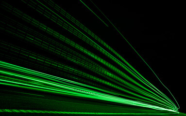 green lights of cars with night. long exposure