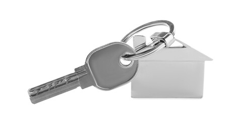 Key with metal house shaped keychain on white background