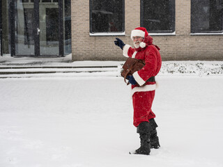 Santa Claus with a briefcase goes to work. New year, new job, concept.