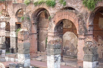 Fototapeta na wymiar Ruins of an ancient city in Italy, old buildings in the open air, streets of ancient cities. Remains of old buildings, columns and statues on the streets of the city of Rome.