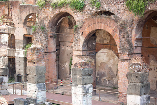 Ruins of an ancient city in Italy, old buildings in the open air, streets of ancient cities. Remains of old buildings, columns and statues on the streets of the city of Rome.