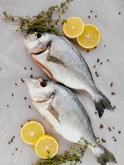 Top view of two dorado fishes ready to be baked