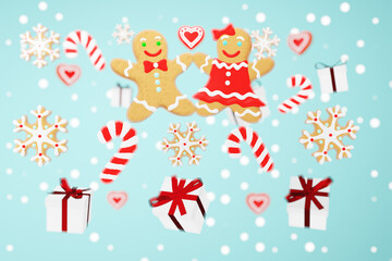 Christmas 3D wallpaper with ginderbread and gift boxes with selective focus on a blue background.
