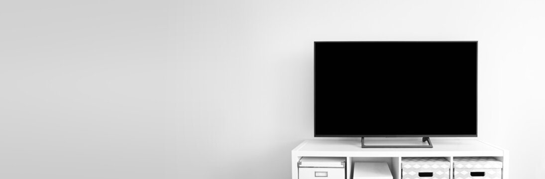 Lcd tv on white shef at modern room interior