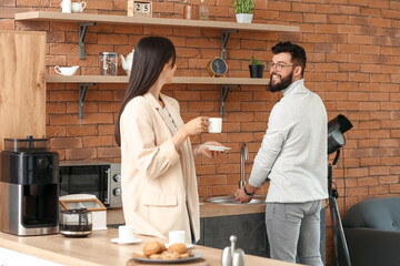 People having coffee break in office