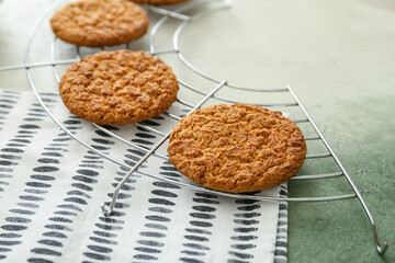 Grid with tasty hojicha cookies on grunge background
