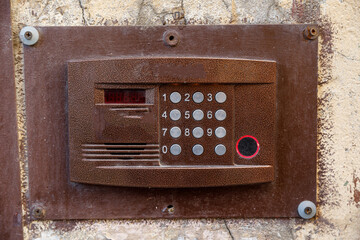 Fototapeta na wymiar old intercom at the entrance to a residential building