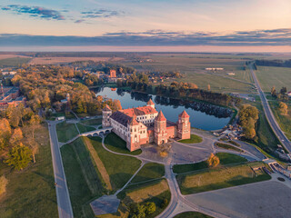 Mir castle in the sunsetlight. Drone aerial photo.