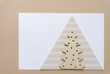 Fototapeta premium wooden christmas tree on paper triangle 