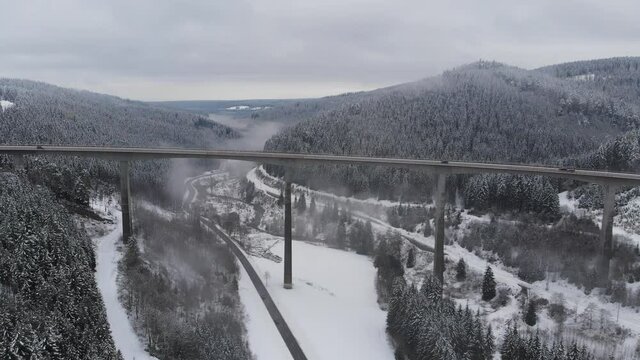 Big Bridge with traffic in snowy landscape