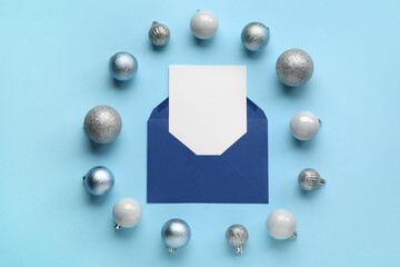 Frame made of balls and Christmas blank greeting card on color background