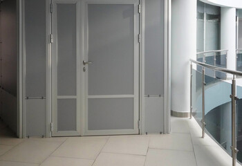 Photo of a white door in an office building