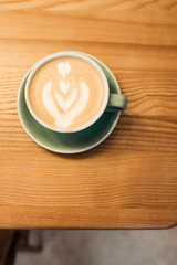 One cup of coffee on the table, latte art