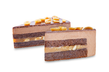 Chocolate peanut caramel slice cake with peanuts on a white isolated background