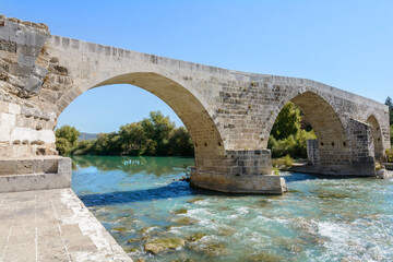 Fototapeta na wymiar Seljuk Bridge in Aspendos. Turkey. Aspendos Bridge