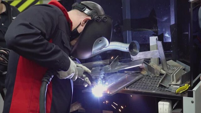 Work of the welder on the modern technological equipment