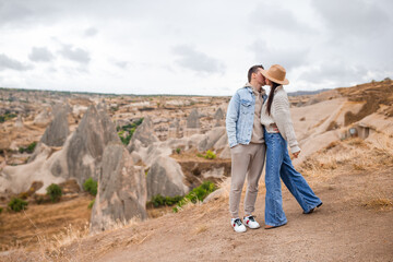 Happy couple on summer vacation in famous place. Cave formations.