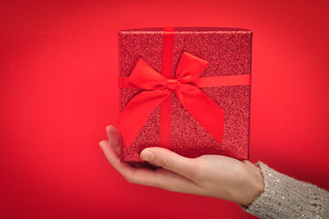 Red present box with bow. Gift for Christmas 