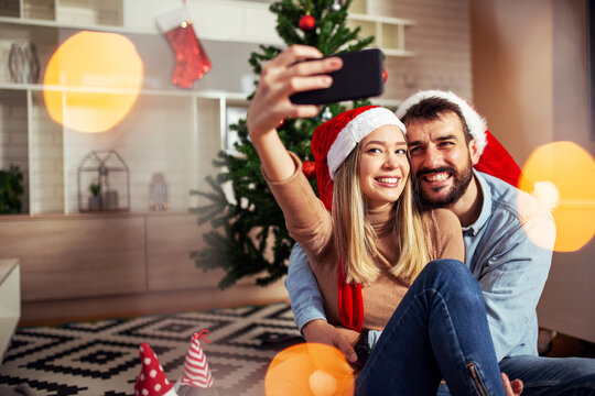 Sweet love couple make selfie at christmas